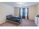 Comfortable bedroom featuring neutral walls, two windows, and cozy carpet at 2325 Sailor Ln, Suwanee, GA 30024