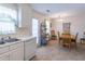 View of the dining room adjacent to the kitchen with a door leading outside at 2325 Sailor Ln, Suwanee, GA 30024