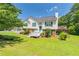Inviting two-story home with a neatly landscaped front yard and an elevated deck at 2325 Sailor Ln, Suwanee, GA 30024