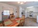 Eat-in kitchen featuring wooden table and white cabinets at 2325 Sailor Ln, Suwanee, GA 30024
