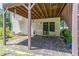 Cozy patio area featuring a textured stone surface and providing shade and outdoor living space at 2325 Sailor Ln, Suwanee, GA 30024