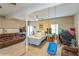 Expansive finished basement offering ample space for recreation and relaxation, featuring a bed and ceiling fan at 7490 Hunters Ridge Dr, Douglasville, GA 30134
