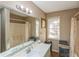 Bathroom featuring a double vanity with a large mirror and a shower-tub combo with a curtain at 7490 Hunters Ridge Dr, Douglasville, GA 30134
