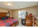 Cozy bedroom featuring a window and neutral decor, offering a serene and inviting space for rest and relaxation at 7490 Hunters Ridge Dr, Douglasville, GA 30134