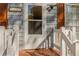 Close-up of front door with white frame and white painted railing at 7490 Hunters Ridge Dr, Douglasville, GA 30134