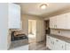 Kitchen featuring white cabinets, tile backsplash, and granite countertops at 7490 Hunters Ridge Dr, Douglasville, GA 30134