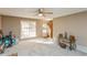 Bright living room featuring neutral walls, carpet floors and lots of sunlight at 7490 Hunters Ridge Dr, Douglasville, GA 30134