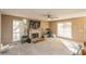 Spacious living room with fireplace, neutral walls, carpet floors, and ample natural light at 7490 Hunters Ridge Dr, Douglasville, GA 30134