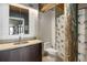 Modern bathroom with wooden beam, stylish sink and fish-themed shower curtain at 170 Boulevard Se # 221E, Atlanta, GA 30312