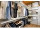 Organized walk-in closet with shelves and hanging racks for clothes and accessories at 170 Boulevard Se # 221E, Atlanta, GA 30312