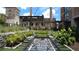 Inviting courtyard featuring foosball table, lounge chairs, and mature landscaping at 170 Boulevard Se # 221E, Atlanta, GA 30312