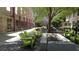 Inviting courtyard with crushed gravel, lounge chairs, and mature shade tree at 170 Boulevard Se # 221E, Atlanta, GA 30312