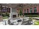Comfortable courtyard with outdoor fireplace, ample seating, and mature landscaping at 170 Boulevard Se # 221E, Atlanta, GA 30312
