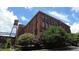 Stunning brick building exterior with lush greenery and a vintage water tower at 170 Boulevard Se # 221E, Atlanta, GA 30312