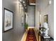 Hallway with neutral color palette, artwork, and a decorative rug at 170 Boulevard Se # 221E, Atlanta, GA 30312