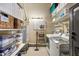 Functional laundry room with washer, dryer, storage shelves, and essential supplies at 170 Boulevard Se # 221E, Atlanta, GA 30312