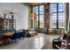 Open living area with exposed brick, high ceilings, large windows, and contemporary furnishings for a modern vibe at 170 Boulevard Se # 221E, Atlanta, GA 30312
