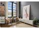 Bright living room featuring a large window, neutral tones, modern art, and curated furniture arrangements at 170 Boulevard Se # 221E, Atlanta, GA 30312