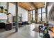 Spacious living room with high ceilings, exposed beams, and large windows providing ample natural light at 170 Boulevard Se # 221E, Atlanta, GA 30312