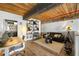 Loft living room with hardwood floors, open shelving, and a unique ceiling at 170 Boulevard Se # 221E, Atlanta, GA 30312