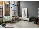 Stylish living room featuring neutral tones, large windows, modern art, and eclectic furniture arrangements at 170 Boulevard Se # 221E, Atlanta, GA 30312