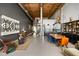Spacious living area with a spiral staircase, modern kitchen, and dining set, ideal for entertaining guests at 170 Boulevard Se # 221E, Atlanta, GA 30312