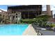 Outdoor pool area with lounge chairs and umbrellas, framed by historic brick structures at 170 Boulevard Se # 221E, Atlanta, GA 30312