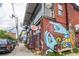 Unique store exterior with colorful mural and quirky decor creates a distinctive curb appeal at 170 Boulevard Se # 221E, Atlanta, GA 30312
