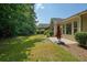This backyard features a patio with an umbrella and views of the surrounding trees and landscaping at 2521 Eden Ridge Ln # 7, Acworth, GA 30101