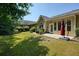 This backyard features a patio with an umbrella and views of the surrounding trees and landscaping at 2521 Eden Ridge Ln # 7, Acworth, GA 30101