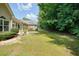 This backyard features a patio with an umbrella and views of the surrounding trees and landscaping at 2521 Eden Ridge Ln # 7, Acworth, GA 30101