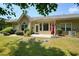 This backyard features a patio with an umbrella and views of the surrounding trees and landscaping at 2521 Eden Ridge Ln # 7, Acworth, GA 30101