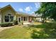 This backyard features a patio with an umbrella and views of the surrounding trees and landscaping at 2521 Eden Ridge Ln # 7, Acworth, GA 30101