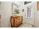 A charming entryway featuring a decorative dresser, mirror, and unique decor at 2521 Eden Ridge Ln # 7, Acworth, GA 30101