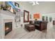 Comfortable living room with fireplace, built-in shelves, leather furniture, and abundant natural light at 2521 Eden Ridge Ln # 7, Acworth, GA 30101