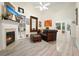 Cozy living room with fireplace, built-in shelves, leather furniture, and ample natural light at 2521 Eden Ridge Ln # 7, Acworth, GA 30101