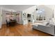 Cozy living area with a fireplace, custom built-ins, and a large arched window at 6040 Boulder Bluff Dr, Cumming, GA 30040