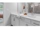 Modern bathroom with double sink vanity, quartz countertop, and framed mirror at 67 Wilder Ridge Way, Lawrenceville, GA 30044