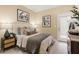 Cozy bedroom featuring neutral tones, stylish furnishings, and a sliding glass door for natural light at 67 Wilder Ridge Way, Lawrenceville, GA 30044