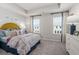 Inviting bedroom with vibrant bedding, a cozy feel, and natural light at 67 Wilder Ridge Way, Lawrenceville, GA 30044