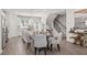 Open-concept kitchen featuring modern stainless steel appliances, an island, and an adjacent dining area at 67 Wilder Ridge Way, Lawrenceville, GA 30044
