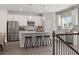 Bright kitchen with stainless steel appliances, island seating, and modern pendant lights at 67 Wilder Ridge Way, Lawrenceville, GA 30044