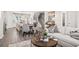 Open-concept living space with kitchen, dining area, and living room connected for modern living at 67 Wilder Ridge Way, Lawrenceville, GA 30044