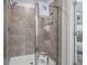 Tiled shower with a glass door and a convenient built-in niche at 67 Wilder Ridge Way, Lawrenceville, GA 30044