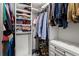 Well-organized walk-in closet with ample storage space for clothes and accessories at 12 Becker Nw Pl, Atlanta, GA 30307