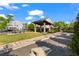Landscaped community space with tables, benches, and a covered outdoor seating area at 12 Becker Nw Pl, Atlanta, GA 30307