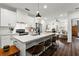 Bright kitchen with stainless steel appliances, marble countertops, and breakfast bar at 12 Becker Nw Pl, Atlanta, GA 30307