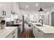 Modern kitchen with white cabinets, marble countertops, and stainless steel appliances at 12 Becker Nw Pl, Atlanta, GA 30307