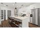 Modern kitchen featuring a large island, stainless steel appliances, and bar stool seating at 12 Becker Nw Pl, Atlanta, GA 30307