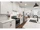 Modern kitchen featuring stainless steel appliances, stylish countertops, and ample lighting at 12 Becker Nw Pl, Atlanta, GA 30307